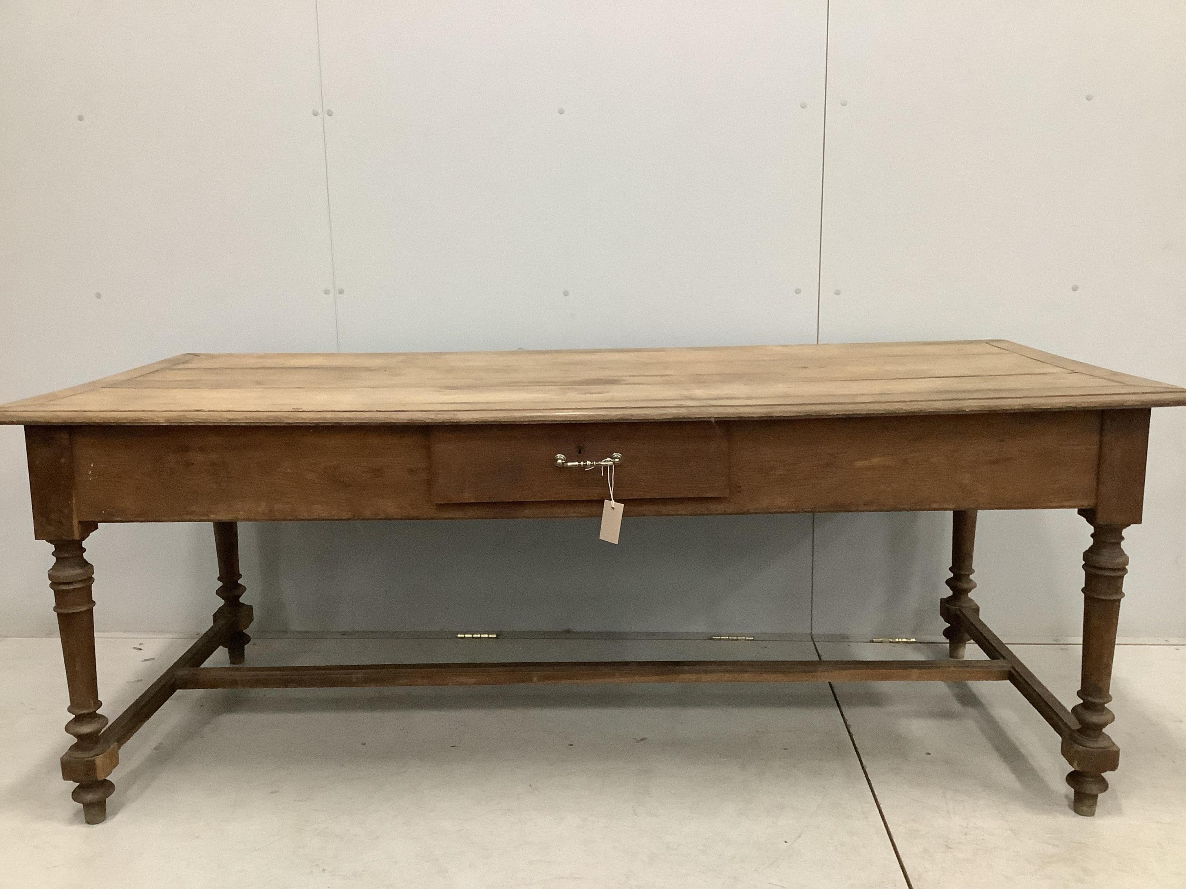 A 19th century French rectangular oak kitchen table, one side drawer and two end drawers, width 199cm, depth 90cm, height 76cm. Condition - poor to fair